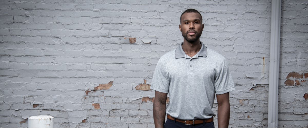 Man with brick wall bg